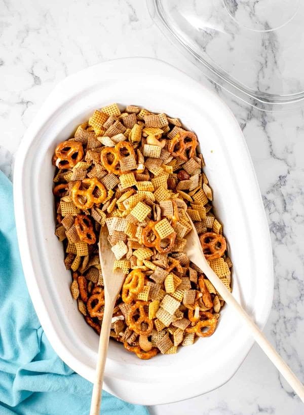 Herb mustard Chex mix with pretzels, almonds, butter, and tangy mustard coating
