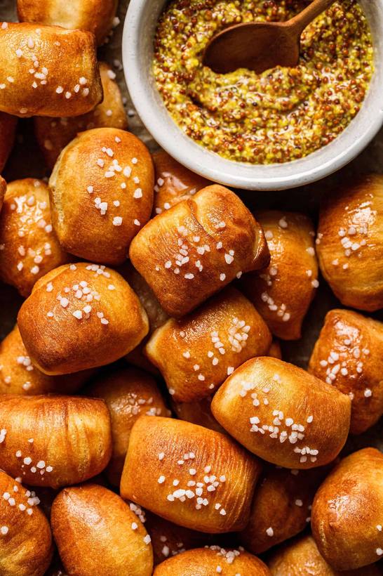 Crispy air fryer soft pretzel bites with a golden crust, served with a creamy dip