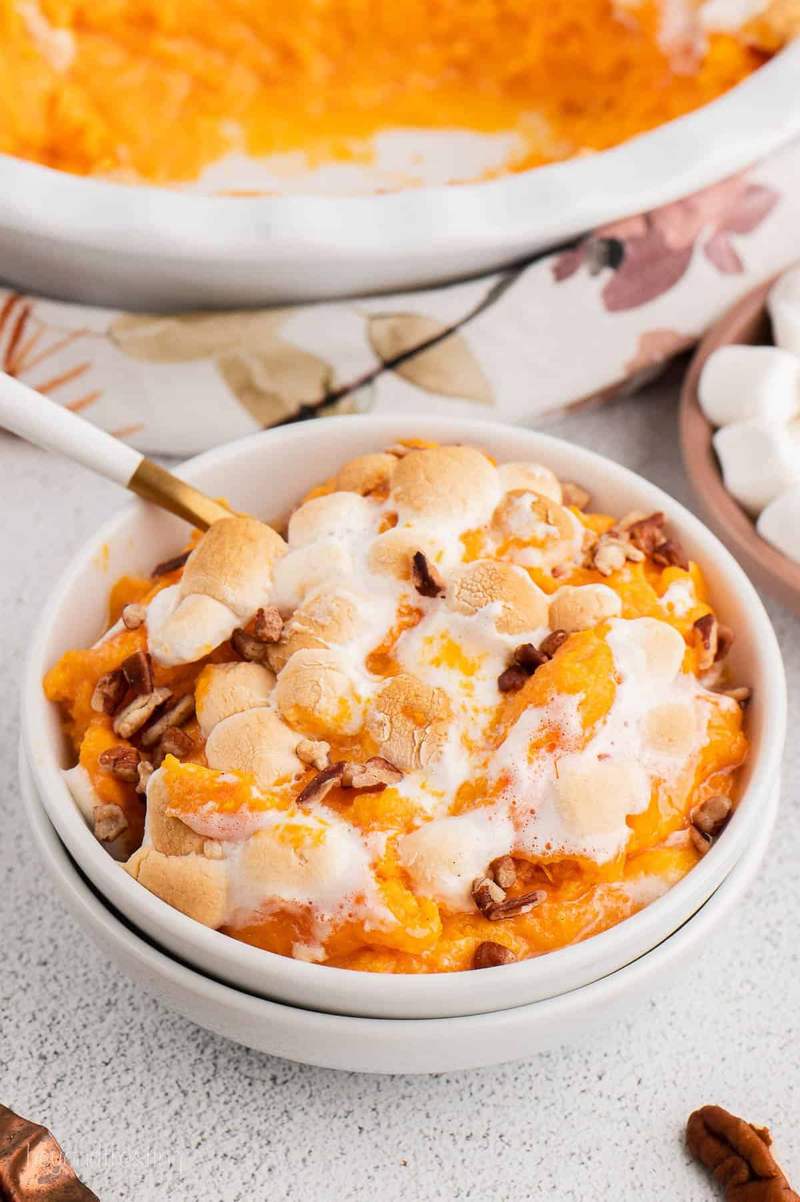 Rich classic sweet potato casserole baked with bourbon, cinnamon, brown sugar, and toasted marshmallows.