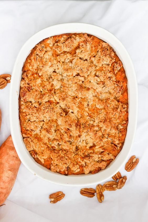 Spiced classic sweet potato casserole accented with orange zest, cinnamon, brown sugar, and toasted pecans.