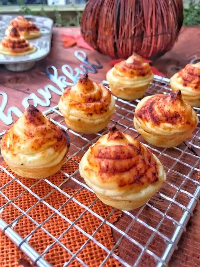 Golden spiral‑shaped potatoes seasoned with herbs and parmesan, baked crisp